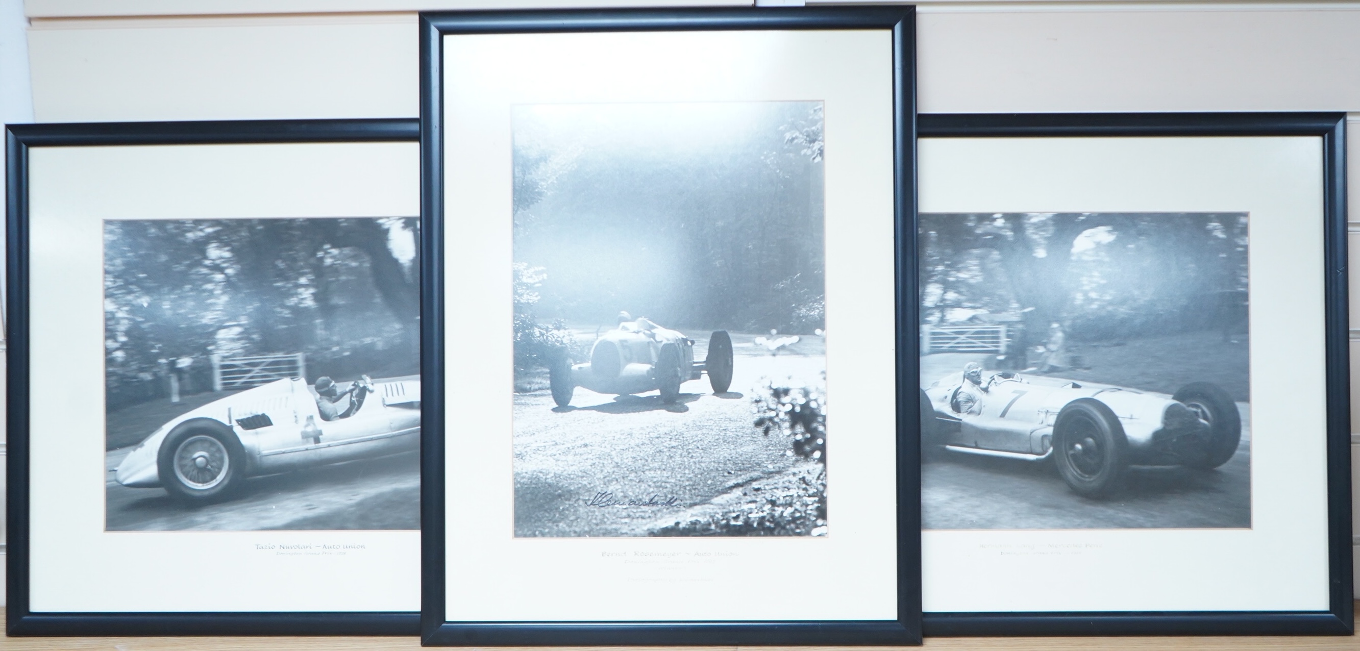 Three 1930s Donington Grand Prix motor racing black and white photographs by Klemantaski, an Auto Union driven by Tazio Nuvolari, an Auto Union driven by Bernd Rosemeyer, both 28 x 38cm, and a Mercedes Benz driven by Her